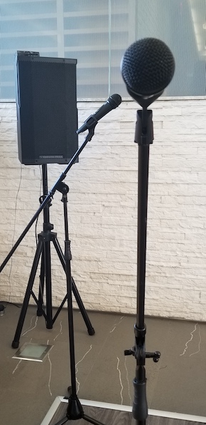 PA system consisting of 2 wireless microphones with mic stands and 1 speaker with speaker stand set up for condo meeting in Toronto