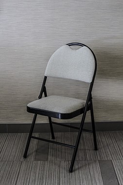 high back folding chair cream selection with good amount of padding on seat and back rest  