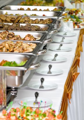 buffet set up including chaffing dishes on rectangular table